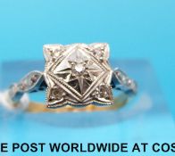 An 18ct gold ring set with diamonds in a platinum setting (size J)