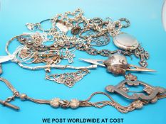 A collection of silver including bracelets, silver chains, four pendants,