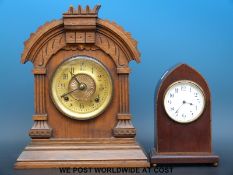 Two mantel clocks, one oak with a carved front and two train movement, 34cm tall,