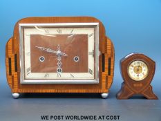 A brass inlaid mahogany clock