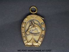 A novelty vesta formed as a horse's head within a horseshoe, stamped Rd 3819, height 4.