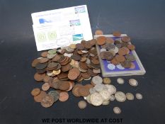 A quantity of Georgian and later world coinage to include 122g of pre-1947 silver,