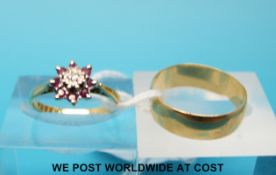 An 18ct gold wedding band (4g) and a 9ct gold ring set with a diamond and rubies