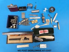 A quantity of items to include whistle, lighter, hip flask, vesta case, seal,
