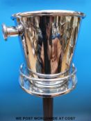 A stainless steel wine cooler on stand