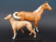 A Beswick Palomino horse and a matt 'Jovial Rodger' greyhound