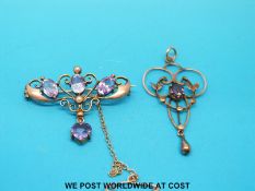 An Edwardian 9ct gold brooch set with amethyst and seed pearls with an Edwardian yellow metal