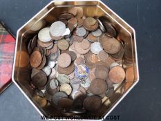 A tin of British coinage including some silver content, redeemable currency,