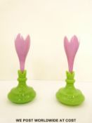 A pair of St Louis overlaid glass posy vases with pink casing over white ground on green bases,