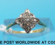 An 18ct gold ring set with nine diamonds in platinum setting (size L)