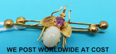A Victorian brooch set with an amethyst and an opal in the form of a bee.
