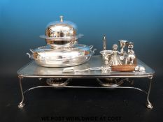 A quantity of silver plated items to include warming plate, serving dishes, wine funnel,