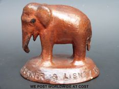 A Turner & Lisney Ltd London earthenware promotional / advertising stoneware elephant paperweight,