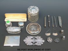 A quantity of hallmarked silver mounted dressing table items including a guilloche enamel example,