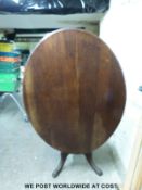 A Victorian mahogany oval breakfast table (maximum width 129cm,