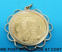 A yellow metal pendant set with an 1892 shield back gold half sovereign (5.