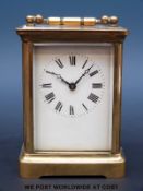 A French brass carriage clock in corniche style case, blue steel pierced hands,