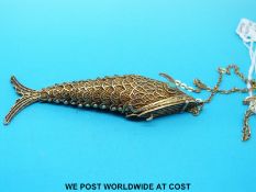 A silver gilt vesta in the form of a fish in filigree with turquoise eyes,