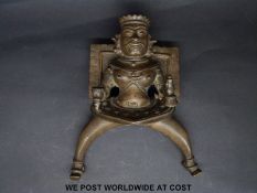 An Indian or similar bronze god, possibly an architectural fitting,