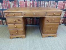 A pine pedestal desk (width 137cm, depth 66cm,