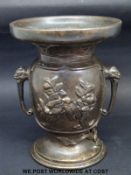 A Meiji period Japanese bronze vase, profusely decorated with animals,