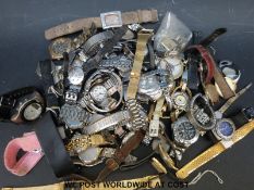 Over fifty various ladies and gentleman's wristwatches.