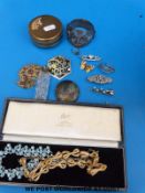 A white metal bracelet with fouled anchor decoration, Celtic brooch marked 925,