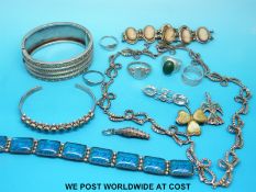 A silver necklace set with marcasite in bow design, silver bangle,