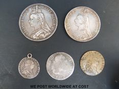 Five coins including a Victorian crown, double florin, mounted George III sixpence,