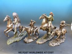 Four Verona bronzed resin cowboys and Indians together with cards and prints