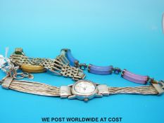 A ladies silver dress watch together a silver bracelet,