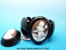 A jet brooch set with a cameo and a bracelet set with a cameo - Bracelet approximately 22cm long.