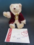 Steiff limited edition 'Christmas Teddy Bear' in musical movement in box with certificate (33cms