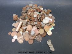 A collection of coins to include silver and overseas coinage