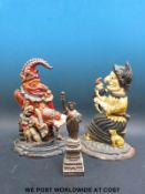 A pair of Punch and Judy door stops together with a Statue of Liberty souvenir