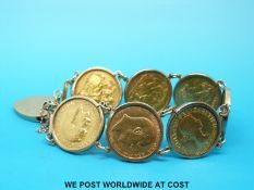 A 9ct gold bracelet set with seven gold full sovereigns 1904, 1912, 1967, 1898, 1967,