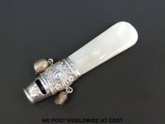 A Victorian hallmarked silver mother of pearl handled baby's rattle / whistle, Chester 1898,