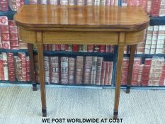 A 19thC mahogany fold-over tea table with rosewood cross banding and string inlay (width 90cm,