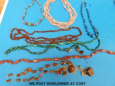 A collection of necklaces to include six strand coral necklace, lapis lazuli,