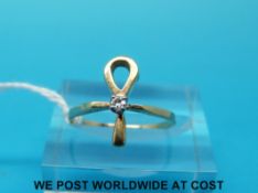 A yellow metal ring in the form of an ankh,