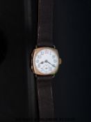 A 9ct gold gentleman's wristwatch with subsidiary seconds dial,