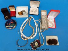 A collection of costume jewellery to include silver, beads, earrings,