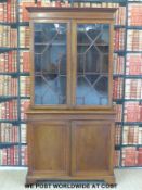 A 19thC astragal glazed inlaid mahogany bookcase with adjustable slide in shelves