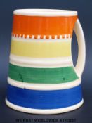 A Susie Cooper Crown Works Burslem mug or tankard with integral handle and multicoloured concentric
