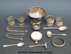 Hallmarked silver items including a pedestal bowl napkin rings, sugar nips, spoon and pusher,