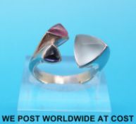 A 9ct white gold ring set with iolite and tourmaline by Prism