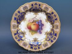 A Royal Worcester cabinet plate with hand-painted fruit by A Shuck and puce backstamp (24cm
