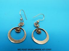 A pair of 9ct gold earrings of circular design (3.