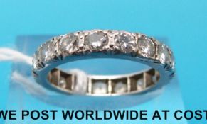 A platinum ring set with 18 diamonds, approximately 1.