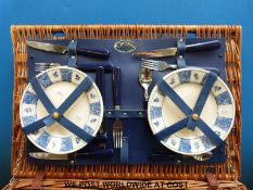 A retro Optima picnic set in wicker hamper,